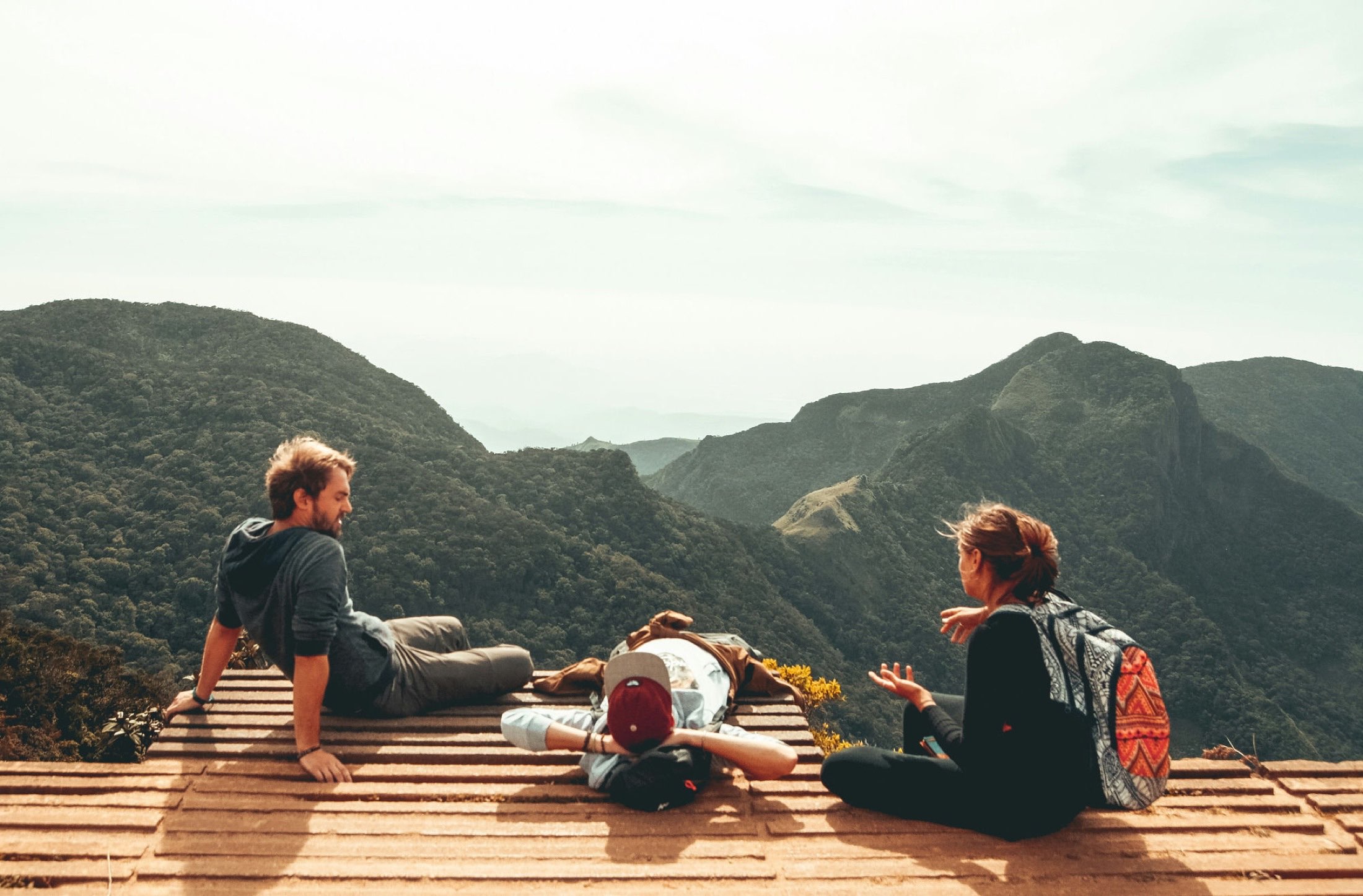 People talking together outdoors in warm daylight